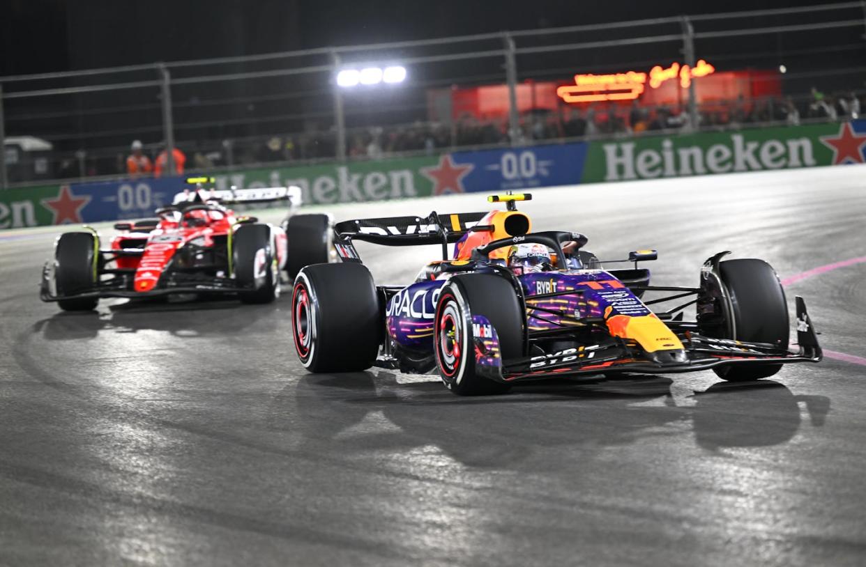 Sergio Perez of Oracle Red Bull Racing, right, and Charles Leclerc of the Scuderia Ferrari team compete in the Las Vegas Grand Prix on Nov. 19, 2023. <a href="https://www.gettyimages.com/detail/news-photo/sergio-perez-of-oracle-red-bull-racing-f1-team-and-charles-news-photo/1790416613" rel="nofollow noopener" target="_blank" data-ylk="slk:Tayfun Coskun/Anadolu via Getty Images;elm:context_link;itc:0;sec:content-canvas" class="link ">Tayfun Coskun/Anadolu via Getty Images</a>