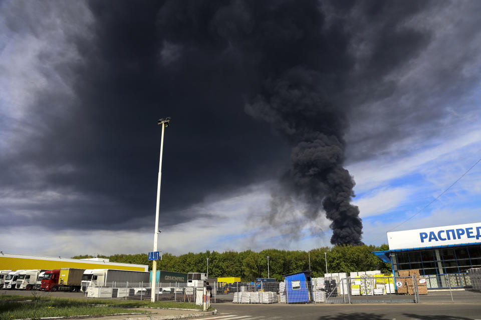 Smoke rises from the oil depot after missiles struck the facility in an area controlled by Russian-backed separatist forces in Makiivka, 15 km (94 miles) east of Donetsk, eastern Ukraine, Wednesday, May 4, 2022. The representative office of the Donetsk People's Republic in the Joint Center for Control and Coordination of the ceasefire regime (JCCC) said on Wednesday that the city of Makiivka was shelled and, according to preliminary data, an oil depot was on fire. (AP Photo/Alexei Alexandrov)