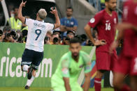 Argentina's Sergio Aguero, left, celebrates after scoring his side's 2nd goal during a Copa America Group B soccer match against Qatar at the Arena do Gremio in Porto Alegre, Brazil, Sunday, June 23, 2019. (AP Photo/Edison Vara)