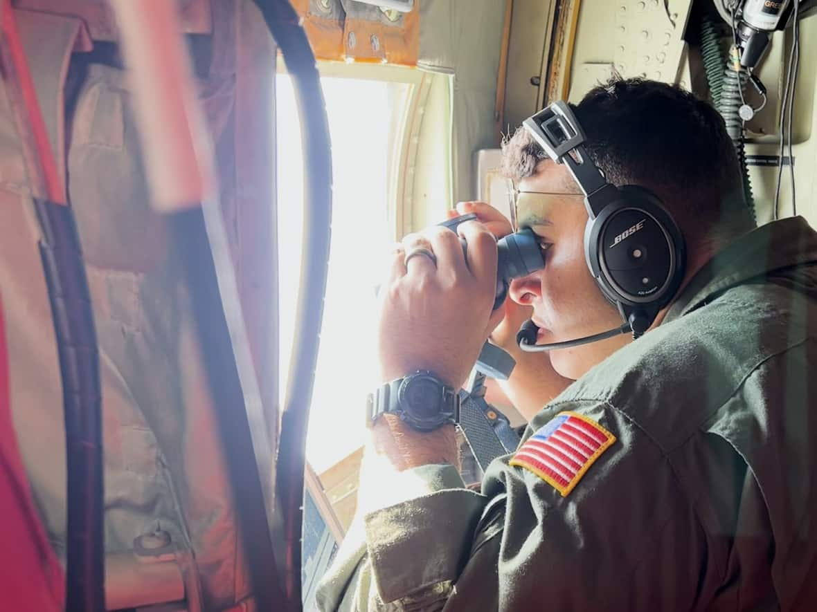 The International Ice Patrol aircraft is equipped with high-tech cameras, but they also spot icebergs the old-fashioned way. (Zach Goudie/CBC - image credit)