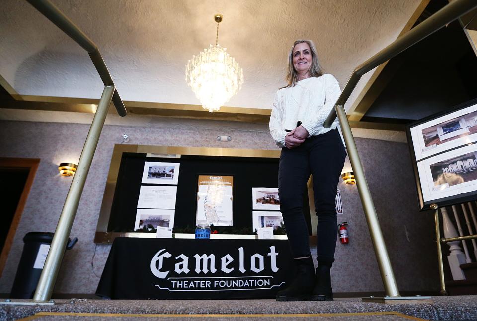 Melissa Sly, president of the Camelot Theater Foundation, poses during a tour at the historic theater in downtown Nevada, Iowa.