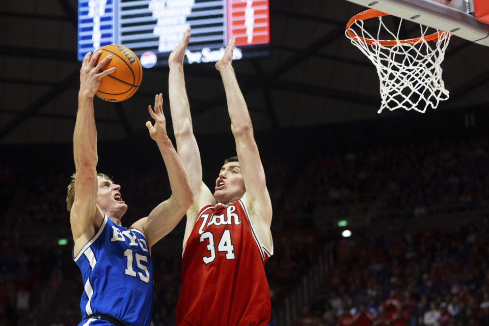 BYU guard Richie Saunders (15) shoots over Utah Utes center Lawson Lovering (34) during an NCAA college basketball game in Salt Lake City, Saturday, Dec. 9, 2023. (Megan Nielsen/The Deseret News via AP)