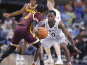 Penn State's Kanye Clary, right, defends against Minnesota's Elijah Hawkins (0) during the first half of an NCAA college basketball game Saturday, Jan. 27, 2024, in State College, Pa. (AP Photo/Gary M. Baranec)