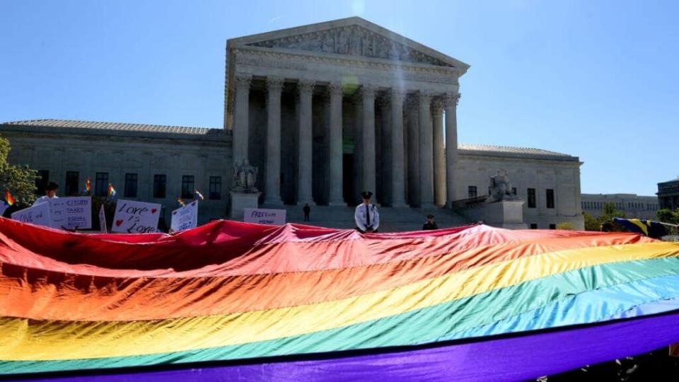 Protesters hold pro-gay rights flags outside the U.S. Supreme Court on April 28, 2015 in Washington, D.C. (Photo: Olivier Douliery/Getty Images)