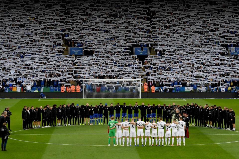 Fans hold Mr Chairman scarves aloft at the first home game since the helicopter crash (Getty Images)