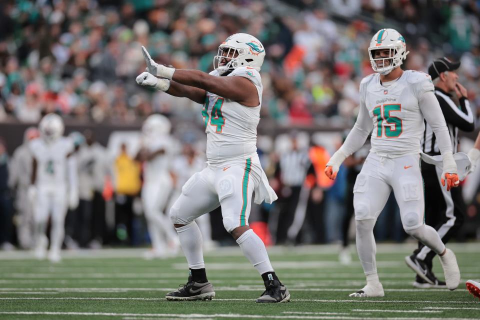 Nov 24, 2023; East Rutherford, New Jersey, USA; Miami Dolphins defensive tackle Christian Wilkins (94) reacts after a sack during the first half against the New York Jets at MetLife Stadium. Mandatory Credit: Vincent Carchietta-USA TODAY Sports