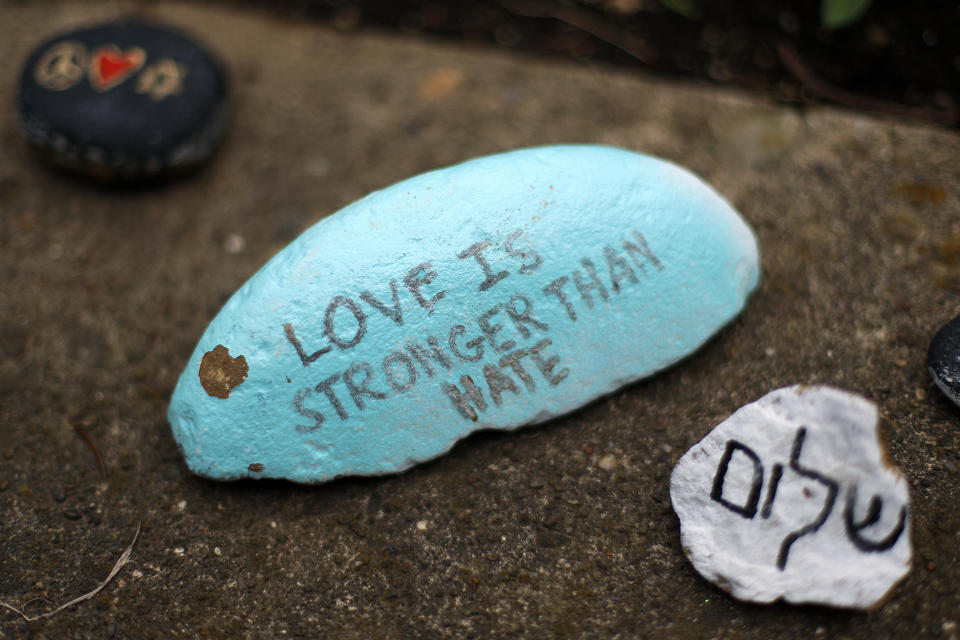 FILE - Rocks painted by students sit on a wall outside the Tree of Life synagogue in Pittsburgh on Oct. 27, 2019, the first anniversary of the shooting at the synagogue, that killed 11 worshippers. The long-delayed capital murder trial of Robert Bowers in the 2018 Pittsburgh synagogue massacre will begin with jury selection beginning April 24, 2023, a federal judge has ruled. (AP Photo/Gene J. Puskar, File)