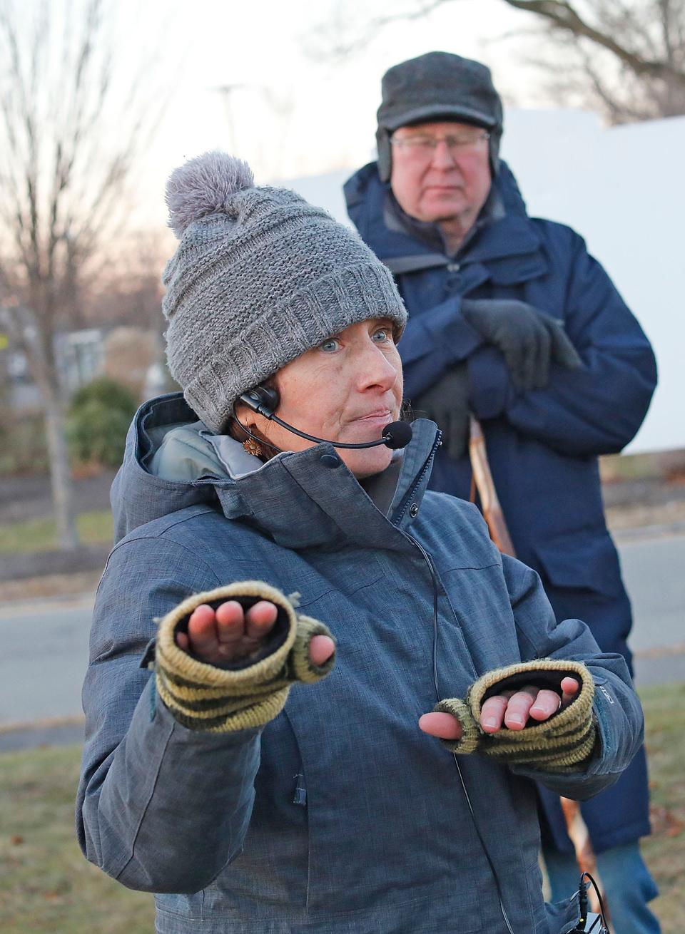 Maura O'Gara leads a winter solstice walking tour for the Quincy Environmental Treasures Program on Dec. 21. The tour included the Sailors Snug Harbor Cemetery, where Capt. Hanson Gregory, inventor of the doughnut, is buried.