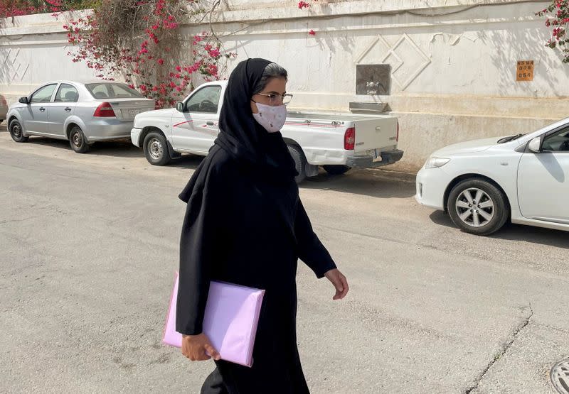 Saudi activist Loujain Al-Hathloul makes her way to appear at a special criminal court for an appeals hearing in Riyadh