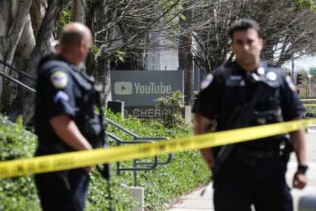Police officers and crime scene tape are seen at YouTube headquarters following an active shooter situation in San Bruno, California, April 3, 2018. REUTERS/Elijah Nouvelage