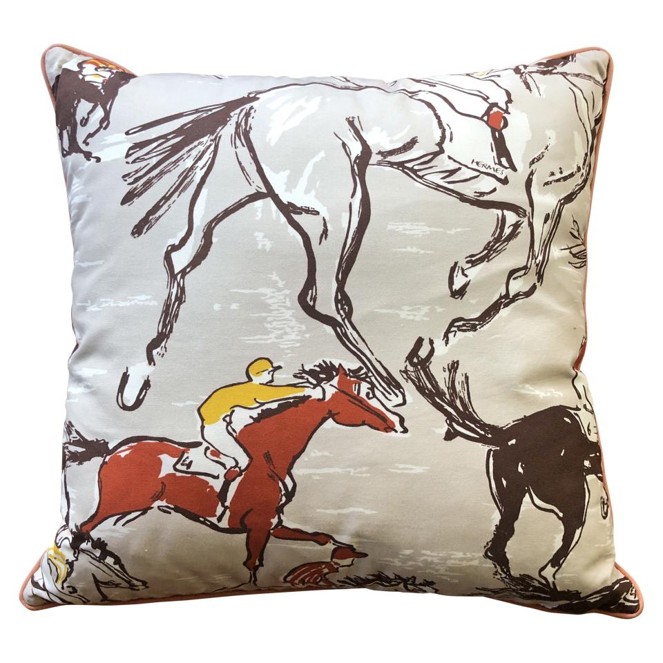 An Hermès pillow with a horse-and-jockey print is part of the sale.