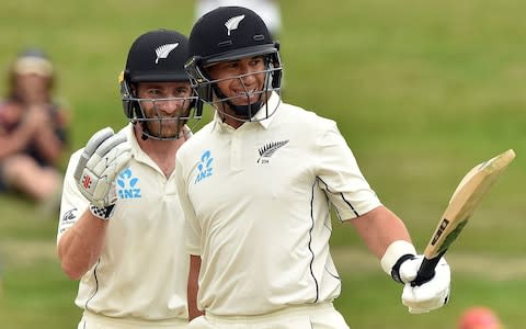 Ross Taylor brought up his hundred just before the rain arrived - Credit: afp