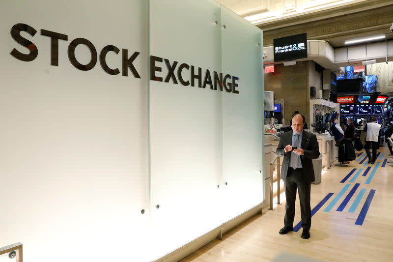 Traders work on the floor of the New York Stock Exchange, (NYSE) in New York, U.S., April 16, 2018. REUTERS/Brendan McDermid