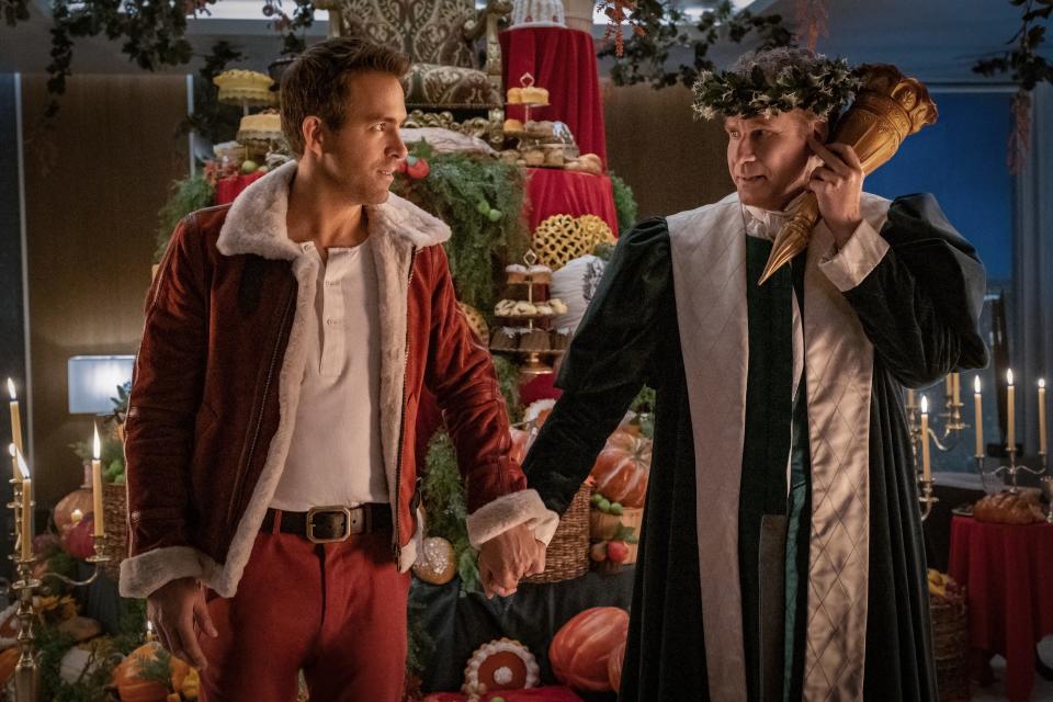 A Scrooge-y PR man (Ryan Reynolds, left) forms an unlikely bond with the Ghost of Christmas Present (Will Ferrell) in the musical comedy "Spirited."