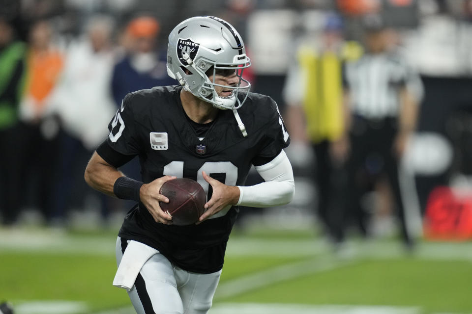 Las Vegas Raiders quarterback Jimmy Garoppolo drops back to run a play against the Denver Broncos during the second half of an NFL football game, Sunday, Jan. 7, 2024 in Las Vegas. (AP Photo/John Locher)