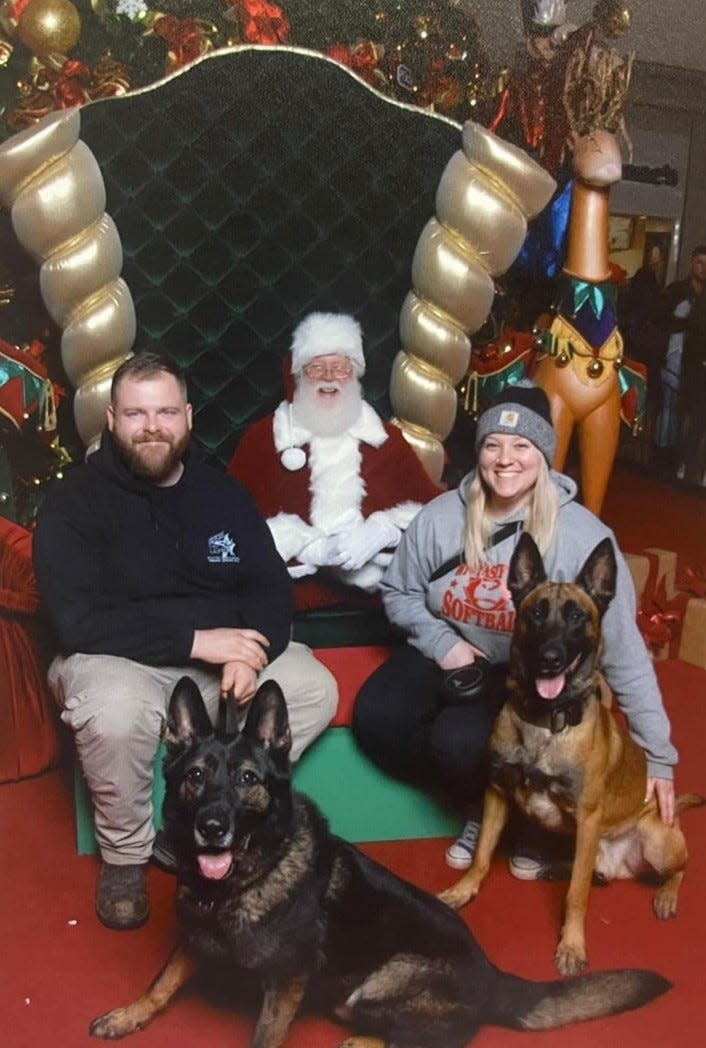 Sherman Holbrook and Jessica Schlumberger with their dogs, 11-year-old Dexter (left) and 4-year-old Thor (right). Both were killed in the fire.