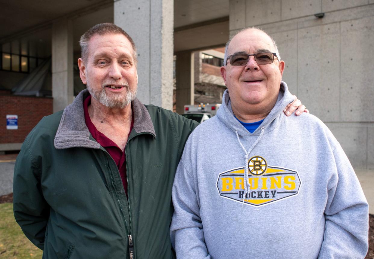From left, David Kornwolf and Jay Toland pose Monday outside Harrington Hospital in Southbridge.