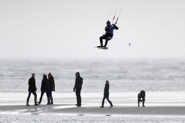 A kite surfer enjoys the windy conditions