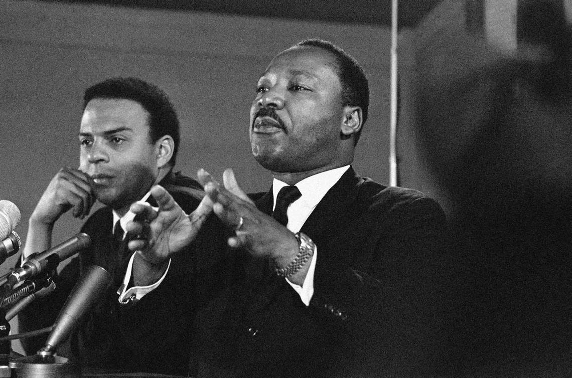 FILE - In this Feb. 7, 1968 file photo, Dr. Martin Luther King Jr., center, speaks to an audience, while promising a massive demonstration in the spring in Washington and hinting the crusade may be extended to the political party conventions in August. King, president of the Southern Christian Leadership Conference said the demonstration in Washington will last for weeks and maybe for months. At left is the Rev. Andrew Young, executive Vice President of the Southern Conference. Veterans of past social movements, such as Young, say the Occupy Wall Street protest has been a welcome response to the abysmal economy and has the potential to galvanize wide support, but whether it will lead to lasting political change remains to be seen. “There’s a difference between an emotional outcry and a movement,” said Young, who worked alongside King as a strategist during the civil rights movement. “This is an emotional outcry. The difference is organization and articulation.” (AP Photo, File)