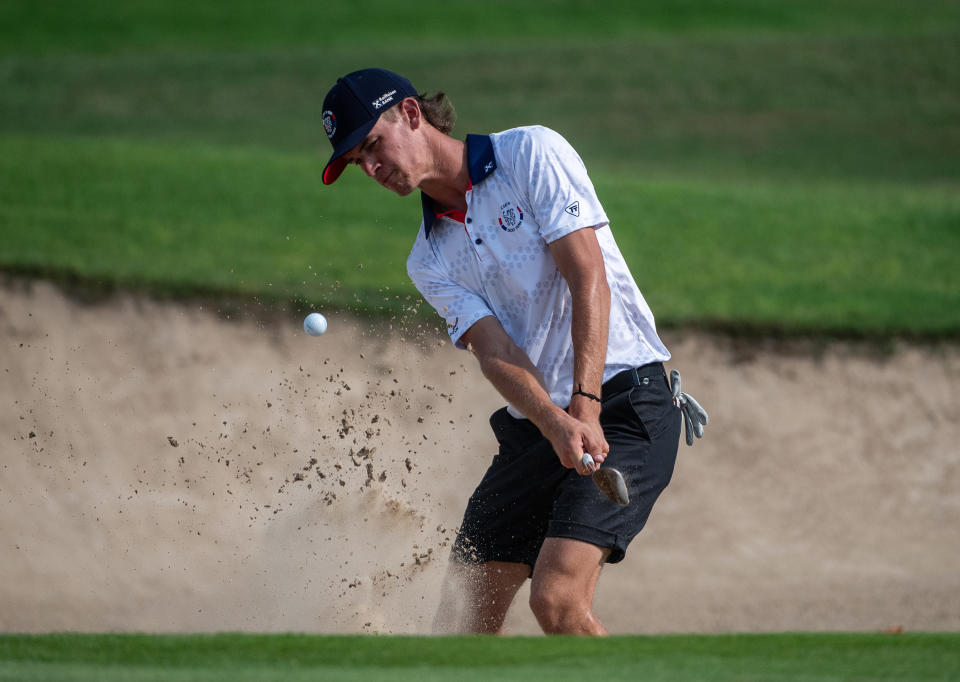 Petr Hruby of the Czech Republic strikes the ball from a bunker to the 13th green during the 2023 World Amateur Team Championships – Eisenhower Trophy at Abu Dhabi Golf Club on October 21, 2023 in Abu Dhabi, United Arab Emirates. (Photo by Martin Dokoupil/Getty Images)