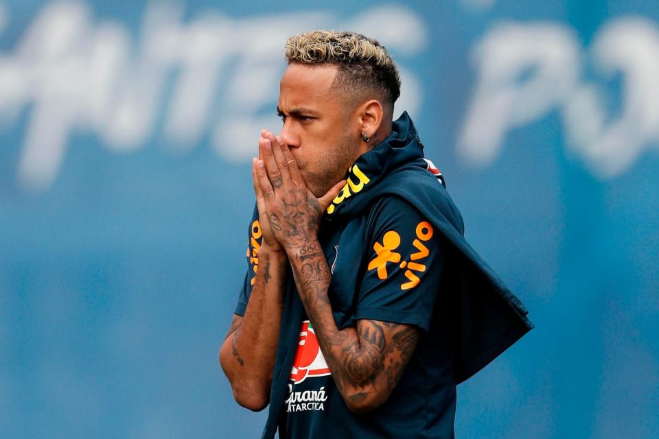 Injury doubt: Neymar hobbled out of Brazil training on Tuesday: AFP/Getty Images