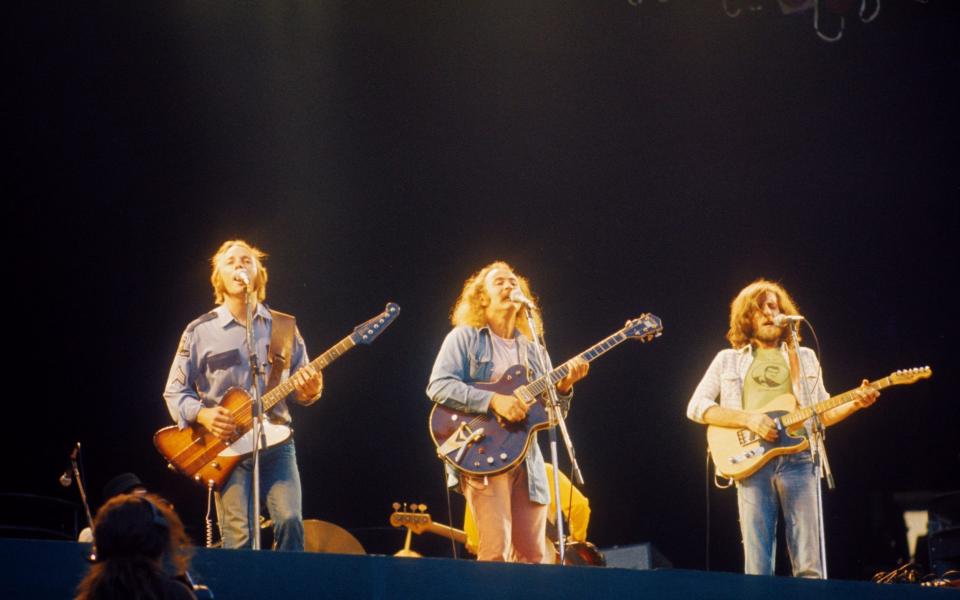 Stephen Stills, Crosby and Graham Nash on stage at Wembley Stadium, September 1974 - Gijsbert Hanekroot/Redferns