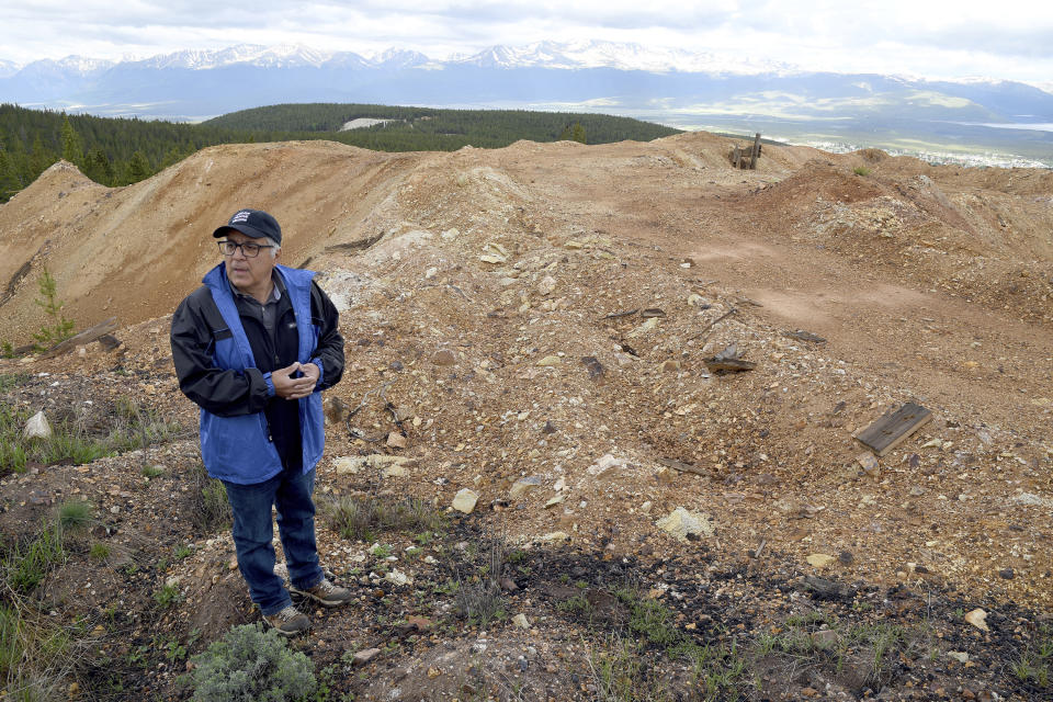 Nick Michael with CJK Milling stands on top of discarded piles of ore in Leadville, Colo. on Thursday, June 27, 2024. (AP Photo/Thomas Peipert)