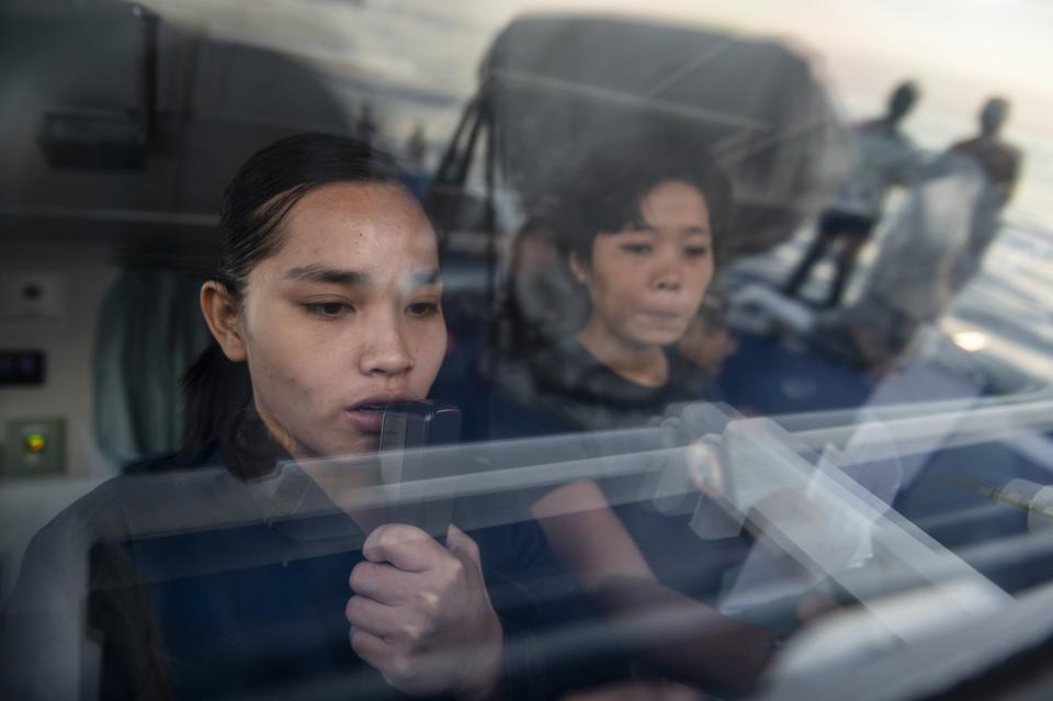 Philippine Coast Guards exchange radio warnings with their Chinese counterparts. (Photo: Lisa Marie David/Bloomberg)