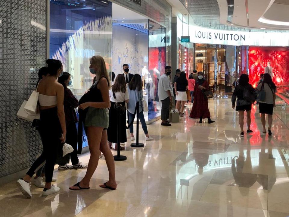 A queue was seen forming outside Louis Vuitton at Ion Orchard on 19 June. (PHOTO: Yahoo News Singapore/Dhany Osman)