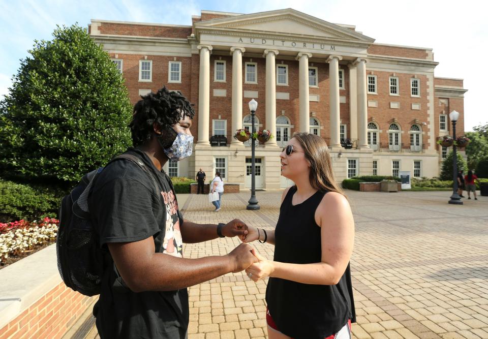 Lacy Gather, right, prays for Melvon Brumfield after a protest gathering in front of Fosters Auditorium on the campus of the University of Alabama Saturday, June 6, 2020, to make their voices heard in the outcry against racial injustice. Fosters Auditorium is the site of then Governor George Wallace's infamous stand in the schoolhouse door in an attempt to block the integration of the University in June of 1963. The University of Alabama, in accordance with a recently passed law, has discontinued the office of Diverstiy, Equity and Inclusion. [Staff Photo/Gary Cosby Jr.]