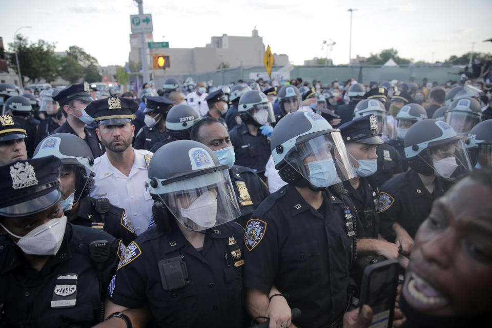 FILE - A large police presence is seen during a protest in the Brooklyn borough of New York, May 30, 2020, in response to the death of George Floyd, a Black man who was killed in police custody in Minneapolis. New York City’s police department has agreed to adopt new policies intended to safeguard the rights of protesters as part of a legal settlement stemming from its response to the Black Lives Matter demonstrations in 2020. The 44-page agreement, filed Tuesday, Sept. 5, 2023, in Manhattan federal court, requires the nation’s largest police department to deploy fewer officers to most public protests. (AP Photo/Seth Wenig, File)