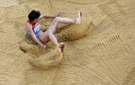 FILE PHOTO: Russia's Victoria Valyukevich competes in the women's triple jump final during the London 2012 Olympic Games at the Olympic Stadium August 5, 2012. REUTERS/Reinhard Krause