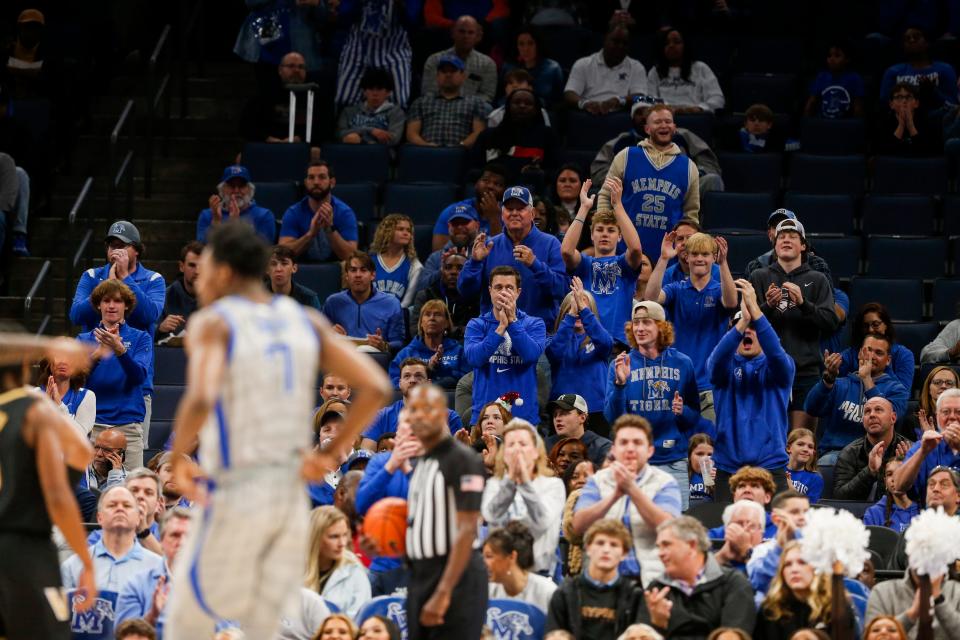 Fans cheer as Memphis’ Nae’Qwan Tomlin (7) checks in for the first time as a Tiger during the game between Vanderbilt University and University of Memphis at FedExForum in Memphis, Tenn., on Saturday, December 23, 2023.