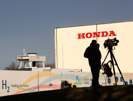 Members of media stand outside the Honda car plant in Swindon, Britain, February 18, 2019. REUTERS/Eddie Keogh