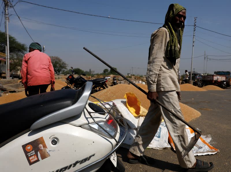 A sticker of PM Modi is pasted on a scooter at a wholesale grain market in Mathura