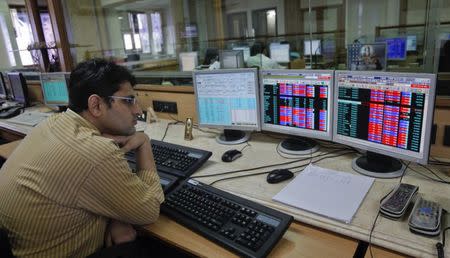 A broker monitors share prices at a brokerage firm in Mumbai August 9, 2011. REUTERS/Danish Siddiqui/File Photo