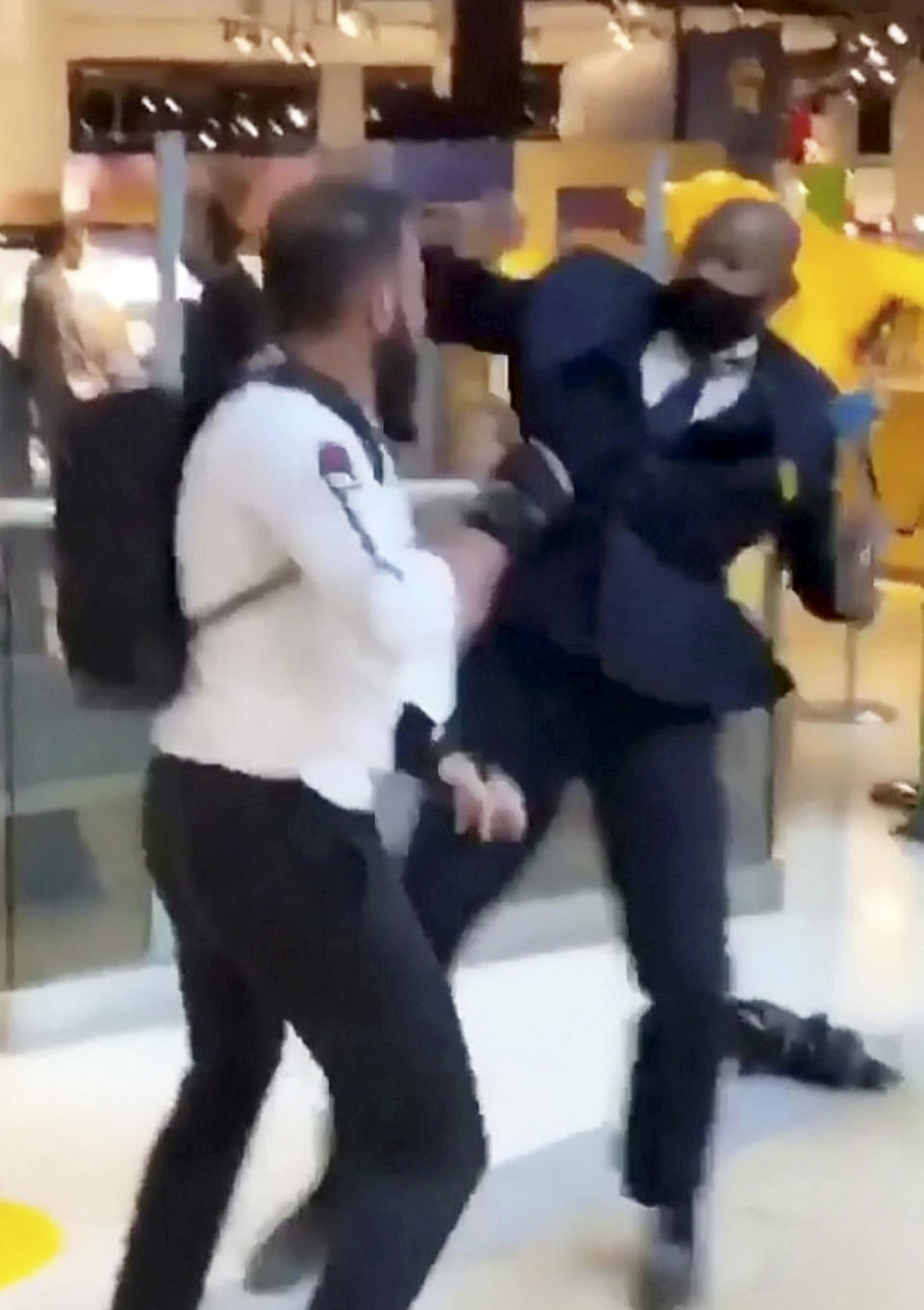 This is the shocking moment a security guard and a shopper viciously brawled outside a Selfridges following a row about entering the store with rollerblades. The smartly-dressed security worker traded punches with the irate customer after violence erupted at Birmingham's Bull Ring shopping centre on Saturday (26/9). The pair can be seen adopting boxing stances before exchanging blows in front of stunned shoppers at the entrance of the posh department store. In the footage, obtained by website Birmz Is Grime, one man can be heard saying "chill man" before the video ends with two burly men continuing to swing punches.