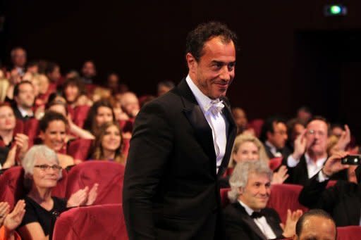 Mexican director Carlos Reygadas arrives on stage after being awarded with the Jury Grand Prix for his film "Post Tenebras Lux" during the closing ceremony of the 65th Cannes film festival in Cannes. Reygadas, whose puzzling "Post Tenebras Lux" bagged him best director prize at Cannes, is a darling of the festival that has showcased all four of his often impenetrable films