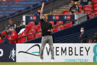 Manchester City's head coach Pep Guardiola gestures during the FA Cup semifinal soccer match between Arsenal and Manchester City at Wembley in London, England, Saturday, July 18, 2020. (AP Photo/Matt Childs,Pool)