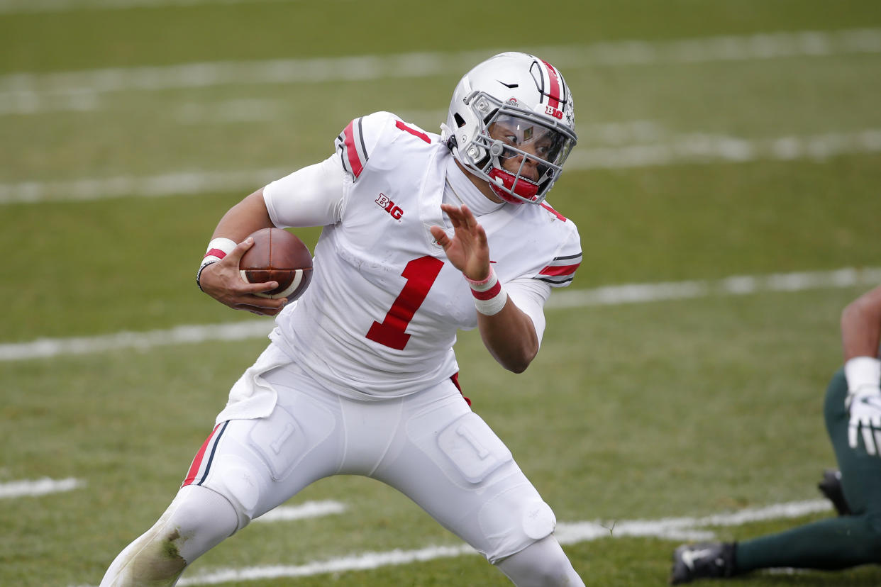 Justin Fields might have to wait, but he'll start games as a rookie for the Chicago Bears. (AP Photo/Al Goldis)