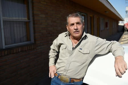 Alan Herrig stands outside of the West Wind Motel in Midland