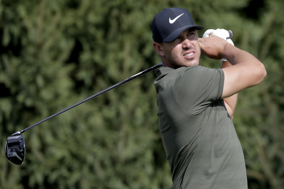 FILE - In this Aug. 23, 2018, file photo, Brooks Koepka tees off on the 14th hole during the first round of the Northern Trust golf tournament, in Paramus, N.J. Koepka says Nike is getting what it wants out of the ad featuring Colin Kaepernick. (AP Photo/Julio Cortez, File)