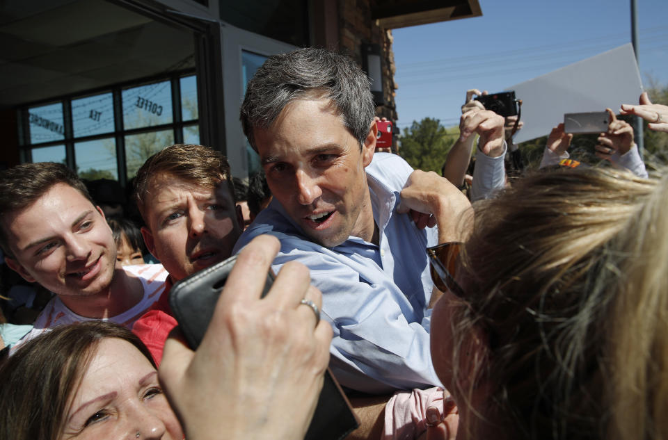 Democratic presidential candidate and former Texas congressman Beto O'Rourke stops for a photo while working his way through a crowd at a campaign stop at a coffee shop Sunday, March 24, 2019, in Las Vegas. (AP Photo/John Locher)