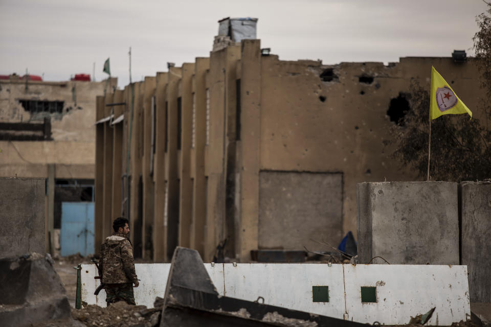 FILE - A Syrian Democratic Forces soldier keeps watch by a prison that was attacked by Islamic State militants, in Hassakeh, Syria, Feb. 8, 2022. Hardly a day passes in northern Syria without Kurdish fighters and opposition gunmen backed by Turkey exchanging gunfire and shelling and concerns are rising that the situation will only get worse in the coming weeks with Ankara threatening to launch a new major operation along its southern border. (AP Photo/Baderkhan Ahmad, File)