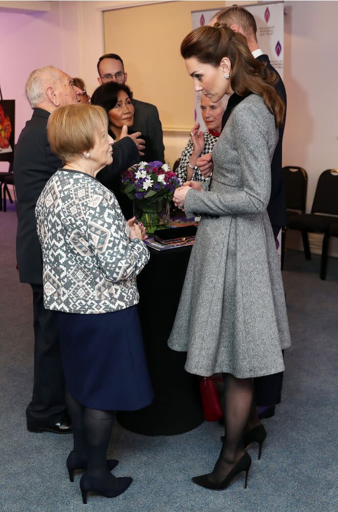 Kate Middleton (right) speaking with survivor Mala Tribich | Chris Jackson/Getty