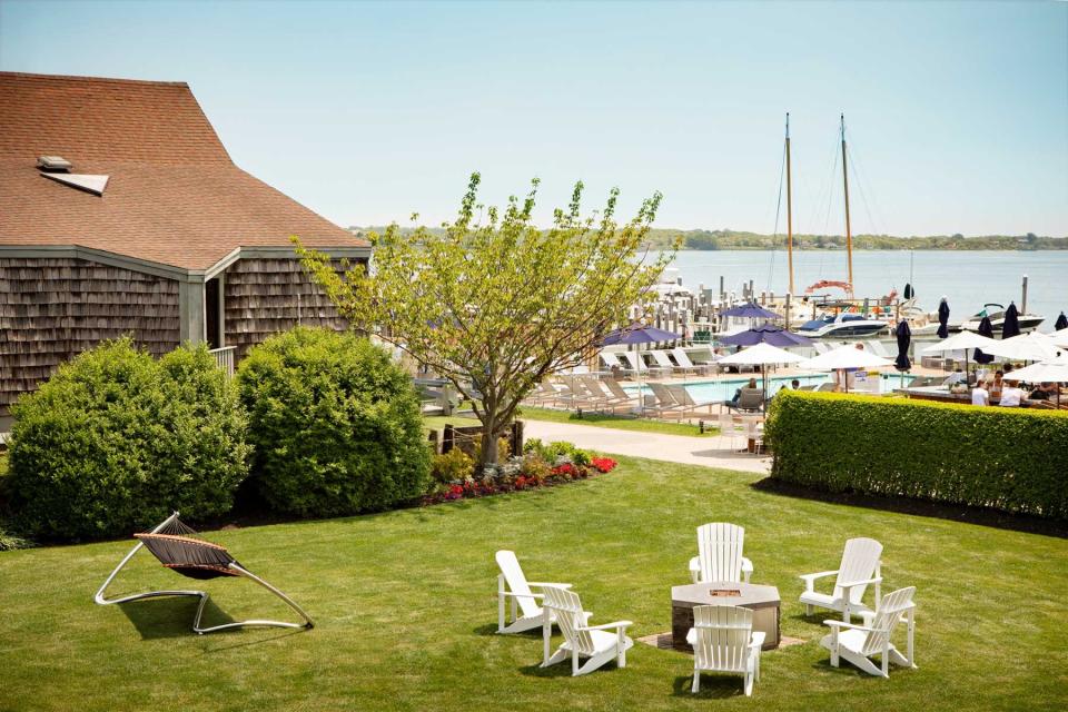 Adirondack chairs around the fire pit at Gurney's Star Island Resort &amp; Marina, voted one of the best resorts in New York State