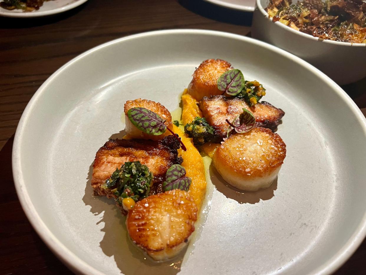 Scallops with cider braised pork belly at Sinema in Nashville on March 29, 2024