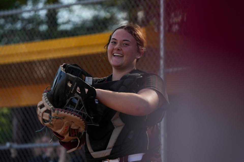 Lutheran Saints Kayla Burns (99) smiles toward the dugout during the game against the Cascade Cadets on Tuesday, April 30, 2024, at Lutheran High School in Indianapolis. The Cascade Cadets defeated the Lutheran Saints 9-1.