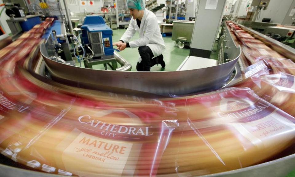 Packets of Cathedral City cheese move along the production line 