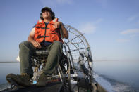 Jose Figueroa, with the California Fish and Wildlife Department, drives an air boat on the Salton Sea at the Sonny Bono Salton Sea National Wildlife Refuge in Calipatria, Calif., Thursday, July 15, 2021. California's largest but rapidly shrinking lake is at the forefront of efforts to make the U.S. a major global producer of lithium, the ultralight metal used in rechargeable batteries. Demand for electric vehicles has shifted investments into high gear to extract lithium from geothermal wastewater around the Salton Sea. (AP Photo/Marcio Jose Sanchez)